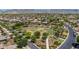 Community aerial view of a lush green park, landscaped streets and desert landscaping in a well maintained neighborhood at 20437 W White Rock Rd, Buckeye, AZ 85396
