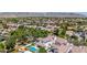 Expansive aerial view of a luxurious neighborhood, featuring a private pool and stunning mountain views at 20437 W White Rock Rd, Buckeye, AZ 85396