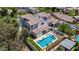 Aerial view of a home with a backyard pool and manicured landscaping at 20437 W White Rock Rd, Buckeye, AZ 85396