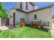Landscaped backyard featuring artificial turf and a gardening area at 20437 W White Rock Rd, Buckeye, AZ 85396