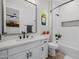 Bathroom featuring a shower and a single sink vanity with framed mirror at 20437 W White Rock Rd, Buckeye, AZ 85396