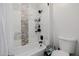 Modern bathroom showcasing tiled shower, bathtub, and essential fixtures for a relaxing experience at 20437 W White Rock Rd, Buckeye, AZ 85396