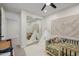 Stylish bedroom with decorative teepee and world map plus mirrored closet doors at 20437 W White Rock Rd, Buckeye, AZ 85396