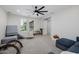 A bonus room features carpet, ceiling fan, natural light, and many comfortable spots for play at 20437 W White Rock Rd, Buckeye, AZ 85396