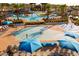 Resort-style community pool area featuring multiple pools, seating, and splash pad at 20437 W White Rock Rd, Buckeye, AZ 85396