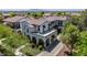 Aerial view of a two-story home featuring lush landscaping, a well manicured lawn and a beautiful exterior at 20437 W White Rock Rd, Buckeye, AZ 85396