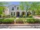 Charming two-story home featuring stucco, a welcoming entrance, and meticulously landscaped yard at 20437 W White Rock Rd, Buckeye, AZ 85396