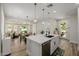 Open kitchen with a central island, modern appliances, and seamless access to living and dining areas, perfect for entertaining at 20437 W White Rock Rd, Buckeye, AZ 85396