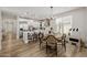 Bright kitchen featuring a breakfast bar, stainless steel appliances, and seamless connection to the dining area at 20437 W White Rock Rd, Buckeye, AZ 85396