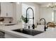 Bright kitchen island featuring modern fixtures, white countertops, and contemporary accents, creating a sleek and inviting space at 20437 W White Rock Rd, Buckeye, AZ 85396