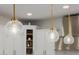 Kitchen lighting featuring three pendant lights hanging from the ceiling at 20437 W White Rock Rd, Buckeye, AZ 85396