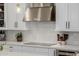 Modern kitchen features stainless steel appliances, white cabinetry, and sleek countertops, blending functionality and style at 20437 W White Rock Rd, Buckeye, AZ 85396
