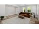 Comfortable living space featuring a leather couch, decorative area rug and natural lighting at 20437 W White Rock Rd, Buckeye, AZ 85396
