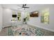 Office featuring a ceiling fan, stylish rug, and a standing desk at 20437 W White Rock Rd, Buckeye, AZ 85396