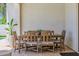 Covered patio features a wooden dining table and seating for six at 20437 W White Rock Rd, Buckeye, AZ 85396