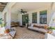 Covered patio offers an inviting outdoor space for dining and relaxation, complemented by a ceiling fan at 20437 W White Rock Rd, Buckeye, AZ 85396