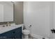 Powder room featuring a vanity with marble countertop and decorative tile floor at 20437 W White Rock Rd, Buckeye, AZ 85396