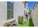 Cozy side yard features modern decor, including a plant hanger, and artificial turf at 20437 W White Rock Rd, Buckeye, AZ 85396