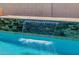 Close-up of a stunning waterfall feature cascading into a sparkling pool, adding a touch of luxury to the outdoor space at 20437 W White Rock Rd, Buckeye, AZ 85396