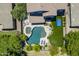 Overhead view of a backyard featuring a pool, spa, manicured landscaping, and outdoor recreation area at 2056 E Carob Dr, Chandler, AZ 85286