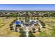 Community park with playground amidst green space and houses, set against a skyline of mountains at 2056 E Carob Dr, Chandler, AZ 85286
