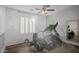 Home gym with natural light, a ceiling fan, and updated workout equipment at 2056 E Carob Dr, Chandler, AZ 85286