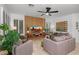 Cozy living room with a modern media center, plush seating, and ample natural light at 2056 E Carob Dr, Chandler, AZ 85286