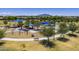 Scenic park featuring modern playground equipment, walking paths, shade trees, and a mountain backdrop at 2056 E Carob Dr, Chandler, AZ 85286