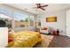 A bright bedroom with multiple windows and a comfortable chair at 20684 W Meadowbrook Ave, Buckeye, AZ 85396