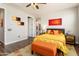 Comfortable bedroom with a dark wood bed frame and views into the home's entryway at 20684 W Meadowbrook Ave, Buckeye, AZ 85396