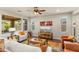 Bright living room with lots of light, stylish furnishings, and a ceiling fan at 20684 W Meadowbrook Ave, Buckeye, AZ 85396