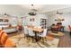 Open-concept living space with kitchen, dining area, and living room with a modern design and abundant natural light at 20684 W Meadowbrook Ave, Buckeye, AZ 85396