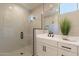 Modern bathroom showcasing a glass shower door and stylish sink with dark hardware at 2121 W Sonoran Desert Dr # 45, Phoenix, AZ 85085