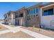 Modern two-story townhome featuring stone accents, a private balcony, and low maintenance landscaping at 2121 W Sonoran Desert Dr # 45, Phoenix, AZ 85085