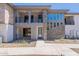 Stylish townhome with stone and stucco facade, private balcony, and sleek black metal railings at 2121 W Sonoran Desert Dr # 45, Phoenix, AZ 85085