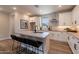 Modern kitchen featuring an island with seating, sleek countertops, and stainless steel appliances at 2121 W Sonoran Desert Dr # 45, Phoenix, AZ 85085