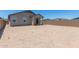 Large backyard offers great potential for outdoor living and landscaping with back patio at 23112 E Twilight Dr, Queen Creek, AZ 85142