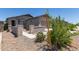 Charming single-story home with well-maintained desert landscaping and inviting entry at 23112 E Twilight Dr, Queen Creek, AZ 85142