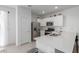 Well-equipped kitchen featuring stainless steel appliances, quartz countertop, and ample cabinets at 23112 E Twilight Dr, Queen Creek, AZ 85142