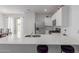Modern kitchen with stainless steel appliances, a quartz countertop, and ample cabinet space at 23112 E Twilight Dr, Queen Creek, AZ 85142