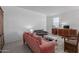 Bright living room featuring modern furnishings, tile flooring, and natural light at 23112 E Twilight Dr, Queen Creek, AZ 85142