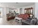 Inviting living room seamlessly flows into a modern kitchen with stainless steel appliances at 23112 E Twilight Dr, Queen Creek, AZ 85142