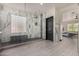 Well-appointed bathroom featuring a walk-in shower with glass blocks, modern fixtures, and tile flooring at 2461 E Stephens Pl, Chandler, AZ 85225
