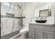 This bathroom is has modern tile and an overhead shower system at 2461 E Stephens Pl, Chandler, AZ 85225