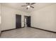 Bright, inviting bedroom featuring neutral paint, a ceiling fan, and an open doorway at 2461 E Stephens Pl, Chandler, AZ 85225