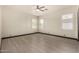 Bright bedroom with modern ceiling fan and window shutters allowing natural light at 2461 E Stephens Pl, Chandler, AZ 85225