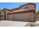 View of a two-story home's facade, showcasing its architecture and curb appeal at 2461 E Stephens Pl, Chandler, AZ 85225