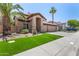 Charming single-Gathering home with a well-manicured lawn, desert landscaping, and a two-car garage at 2461 E Stephens Pl, Chandler, AZ 85225