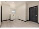 Upstairs hallway features wood-style tile and dark-colored door to a room at 2461 E Stephens Pl, Chandler, AZ 85225