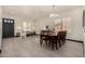 An inviting living room with an adjacent dining area with new floors at 2461 E Stephens Pl, Chandler, AZ 85225